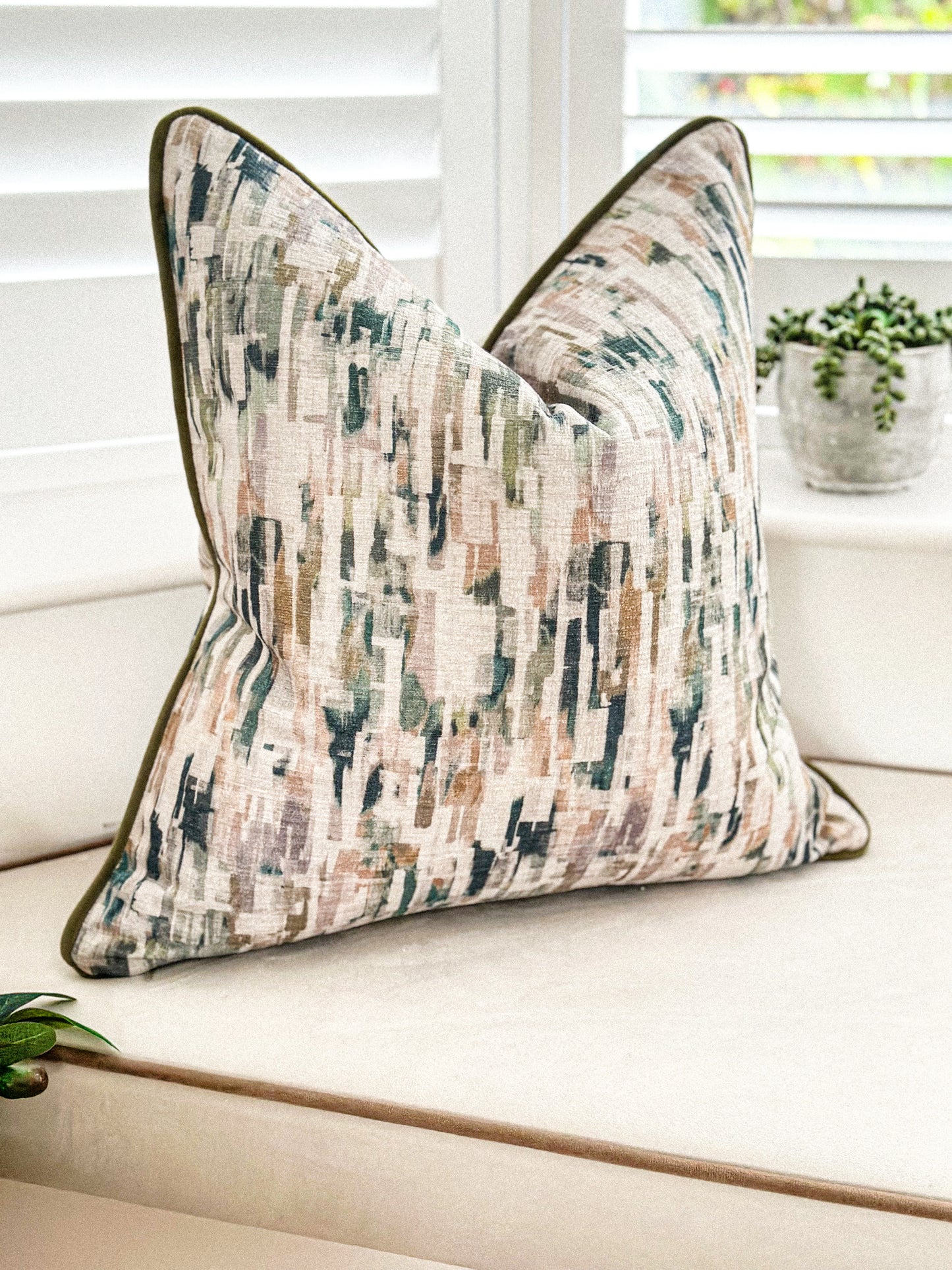 Abstract brushstroke pillow cover in earthy greens and warm neutrals
