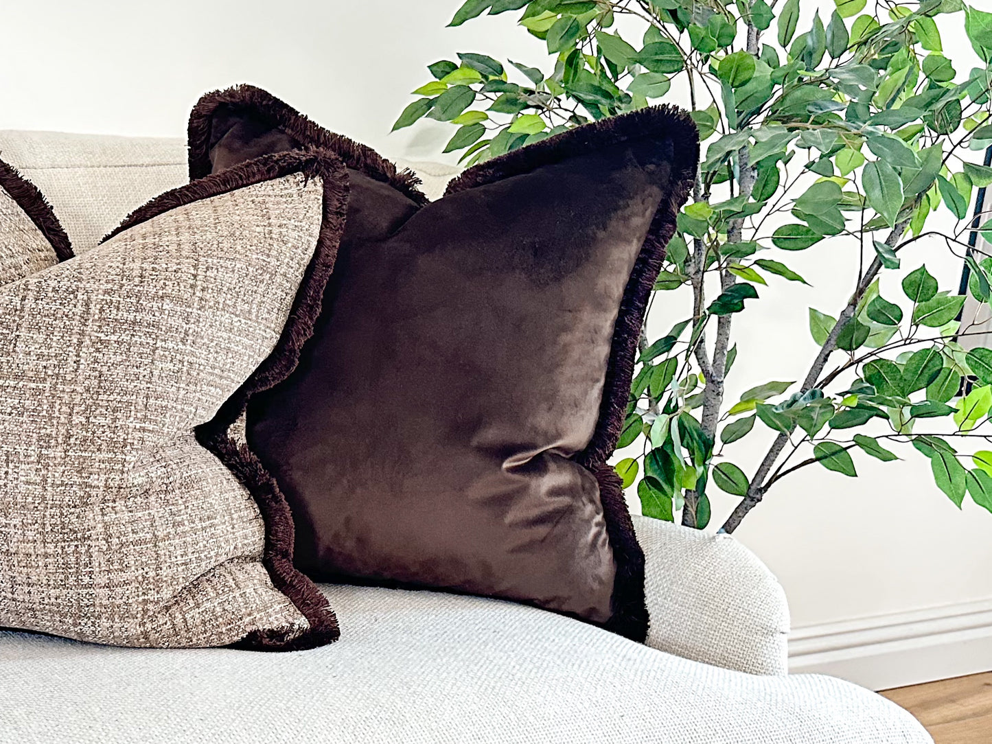 Luxury Dark brown velvet cushion with fringe trim made by the cosy cushion shop.