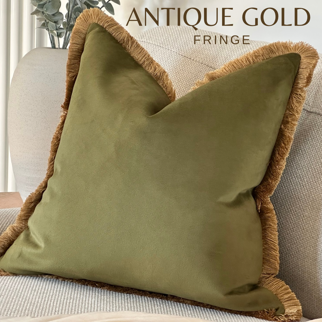 Olive green cushion cover with antique gold fringe.