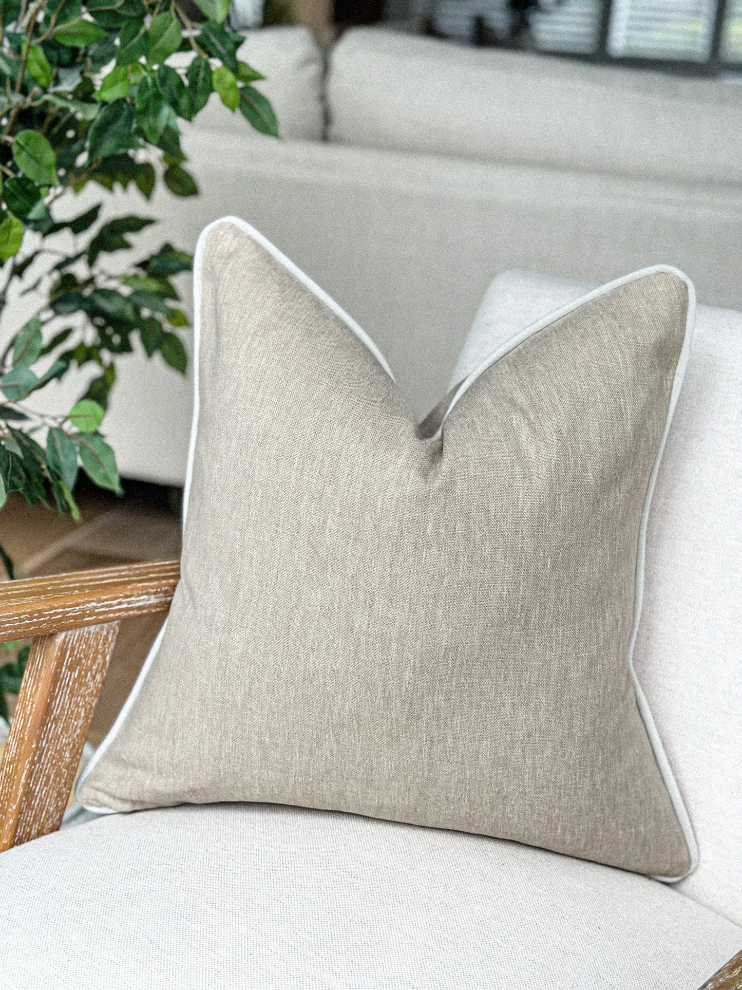 Classic beige scatter cushion with subtle contrast trim — perfect for earthy, understated interiors.