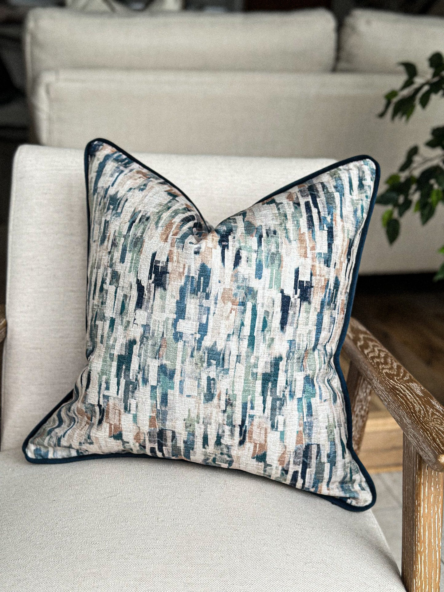 Modern abstract brushstroke pillow cover in calming coastal tones.