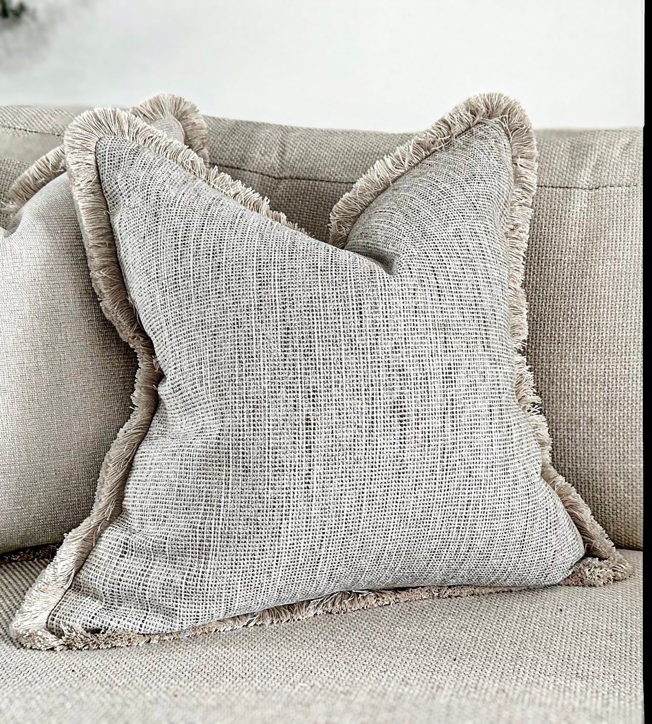 Luxury textured neutral cushion cover with fringe. Custom made bespoke cushions by the cosy cushion shop.