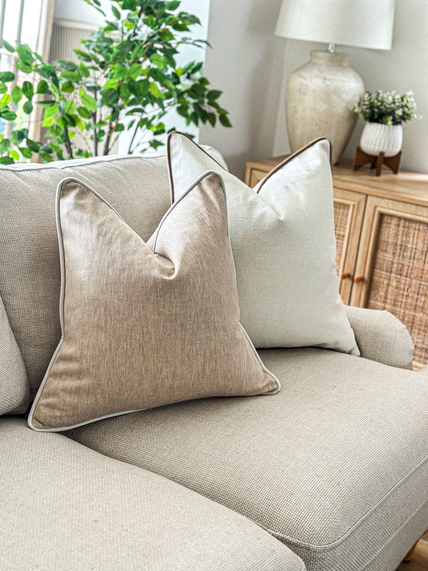 Warm beige linen-look cushion with contrast piping — perfect for neutral, timeless home décor.
