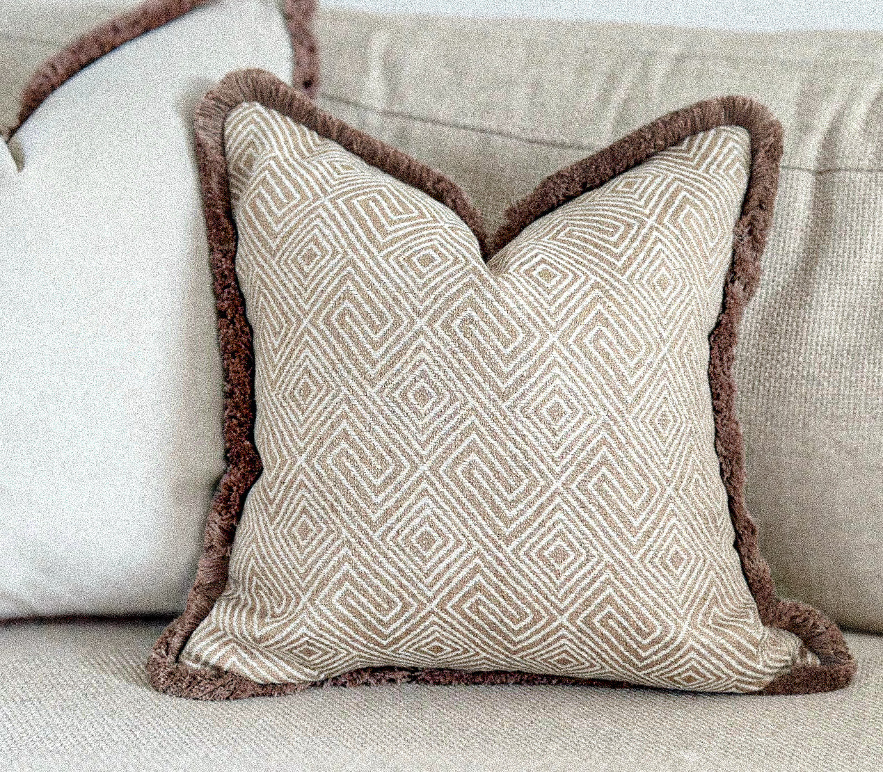 Luxury patterned cushion cover with fringe for neutral country farmhouse home decor styles. Custom made, bespoke cushions by the cosy cushion shop.