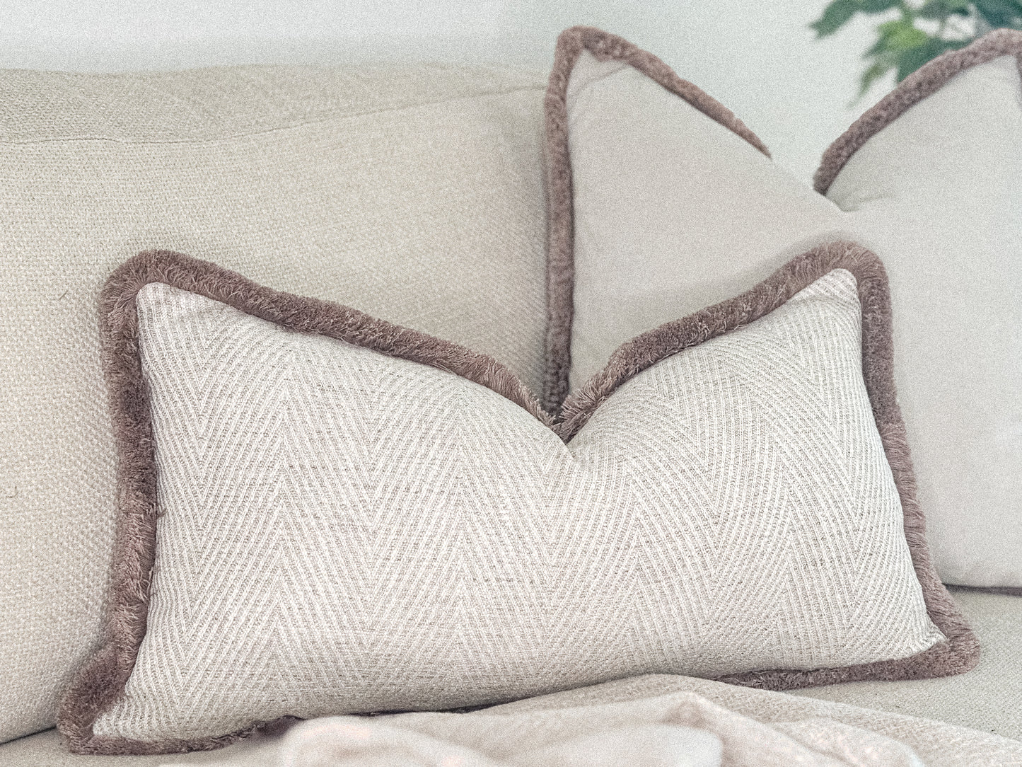 Luxury herringbone cushion cover with fri be trim. Custom made bespoke pillows by the cosy cushion shop.