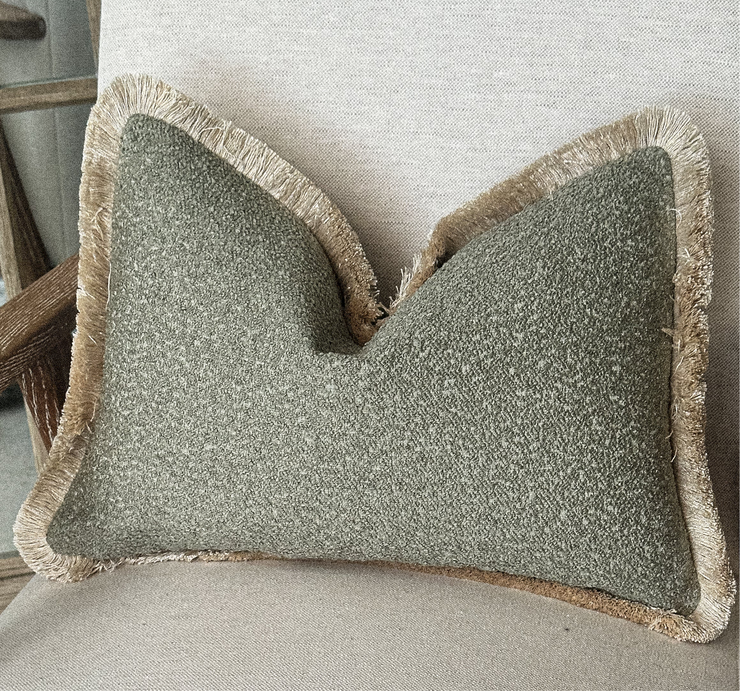 Sage green earthy boucle fringed cushion