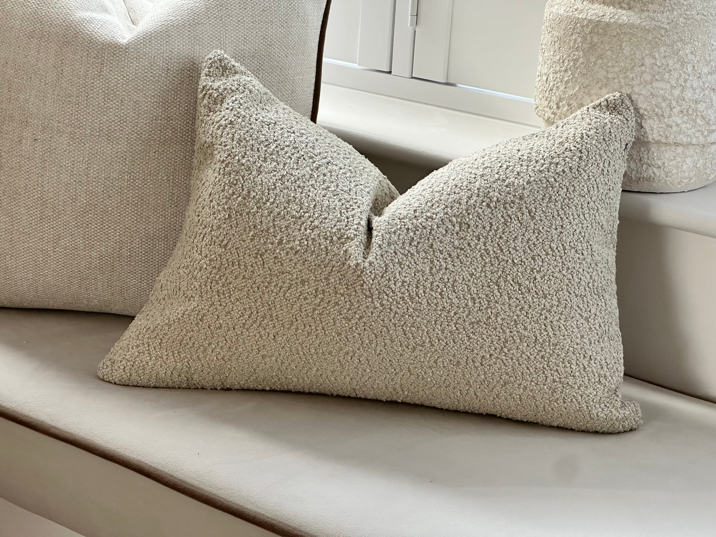 Neutral textured boucle cushion