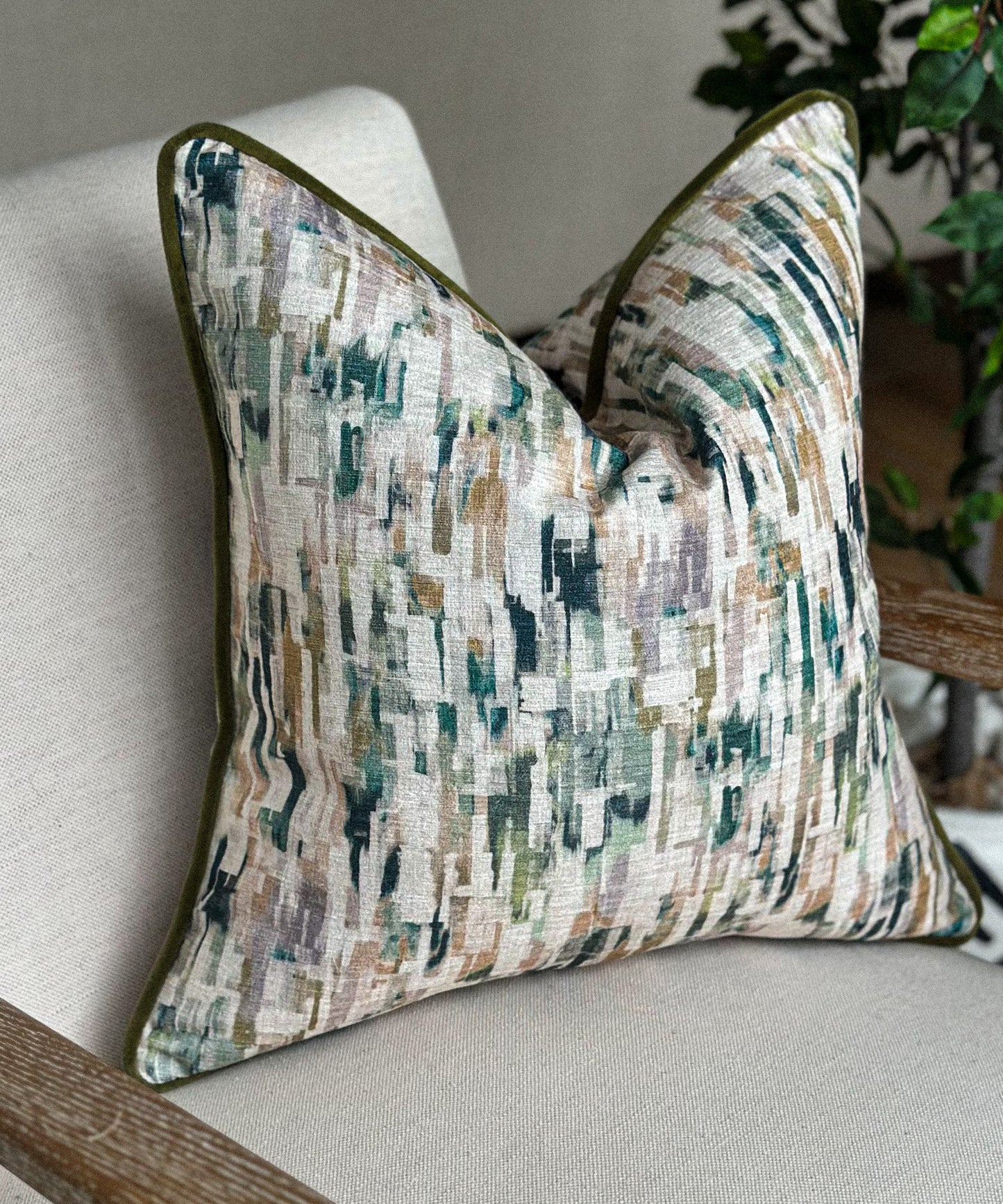 Luxury accent cushion with hues of green.