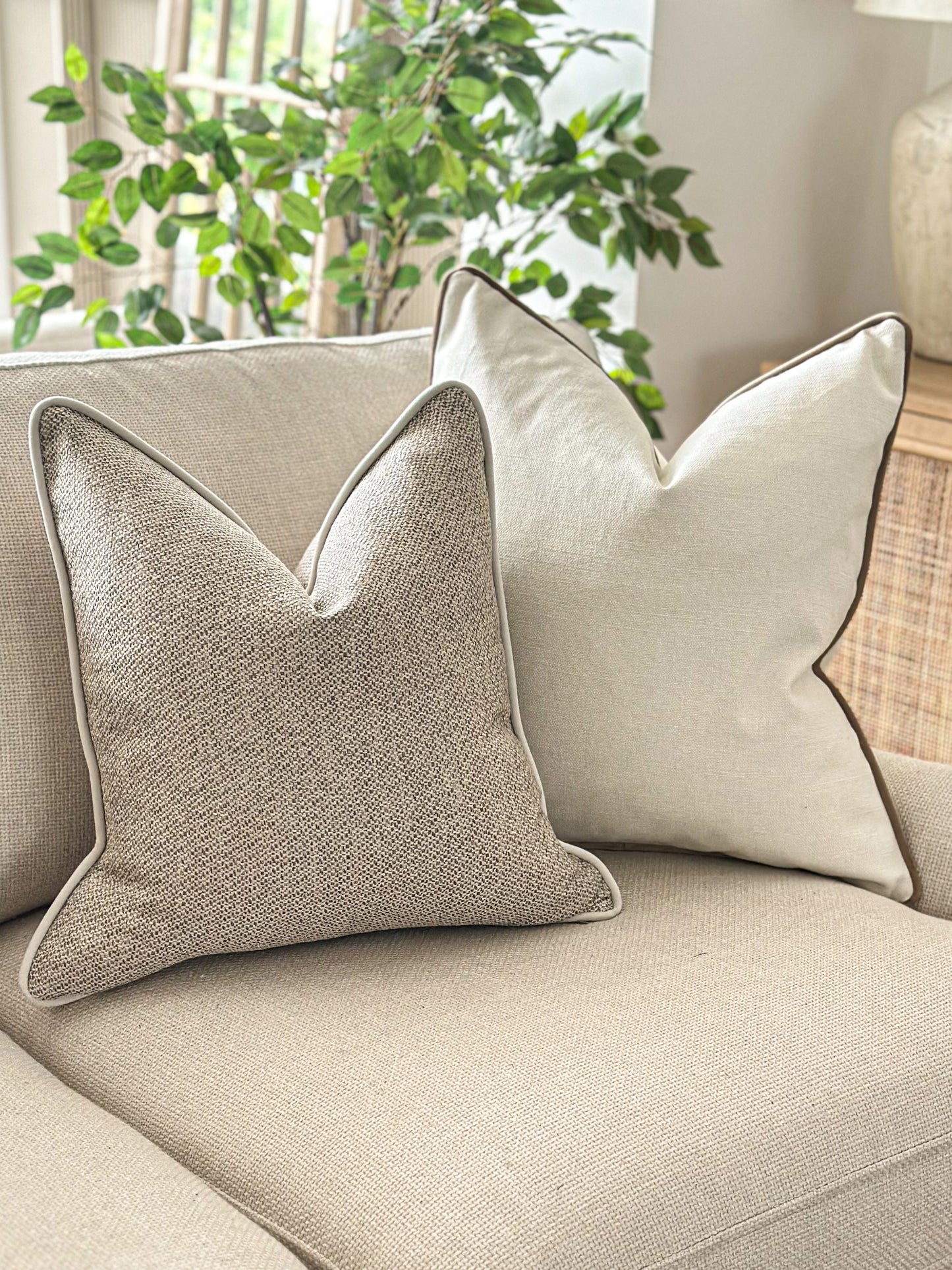Neutral textured scatter cushion with matching piping — perfect for calm, layered living spaces.