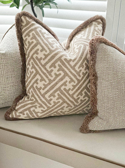 Luxury neutral fringed cushion cover with a beautiful beige design. The best cosy cushions.