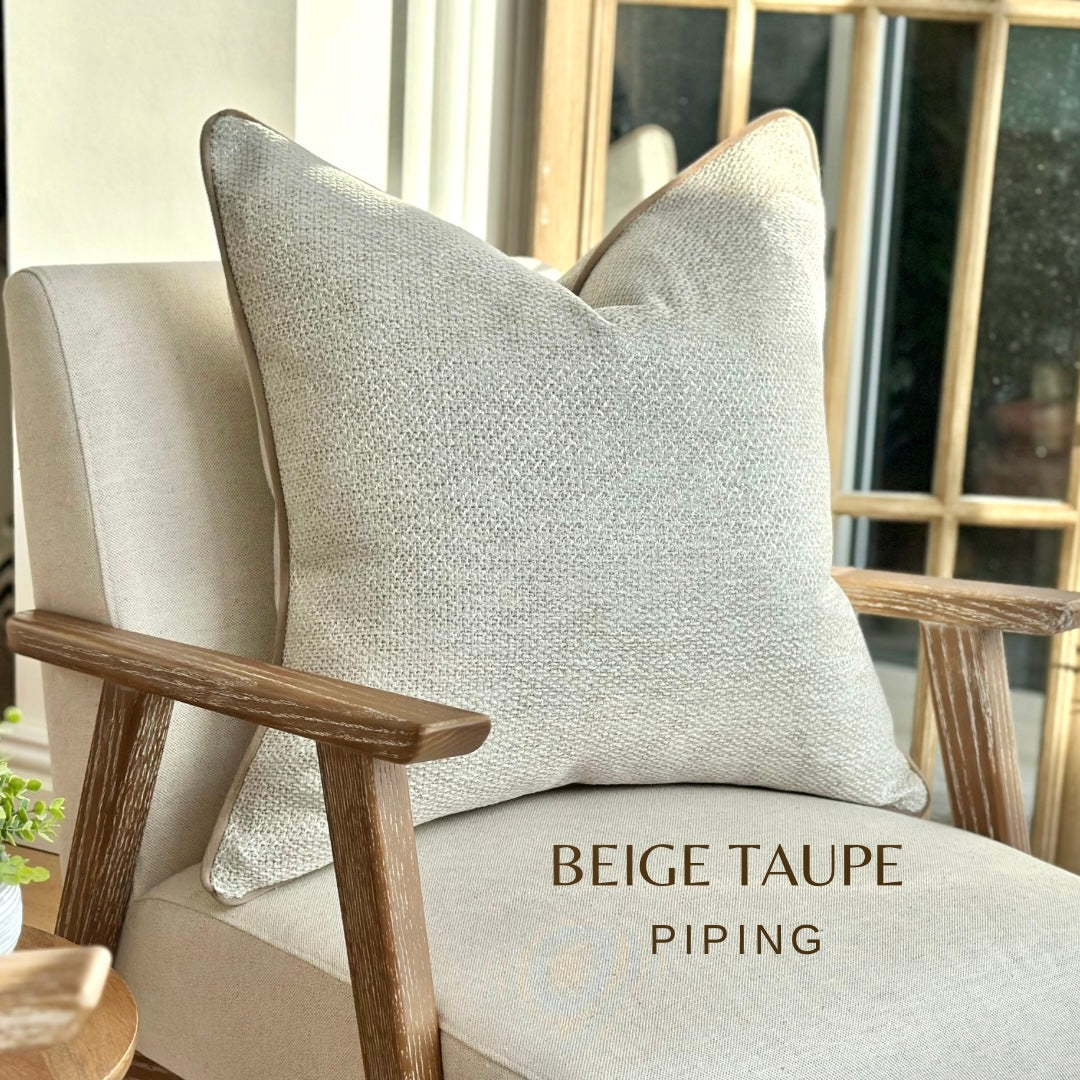 Cream ivory textured cushion with beige contrast piping Trim.