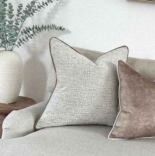 Cosy neutral textured cushion cover.