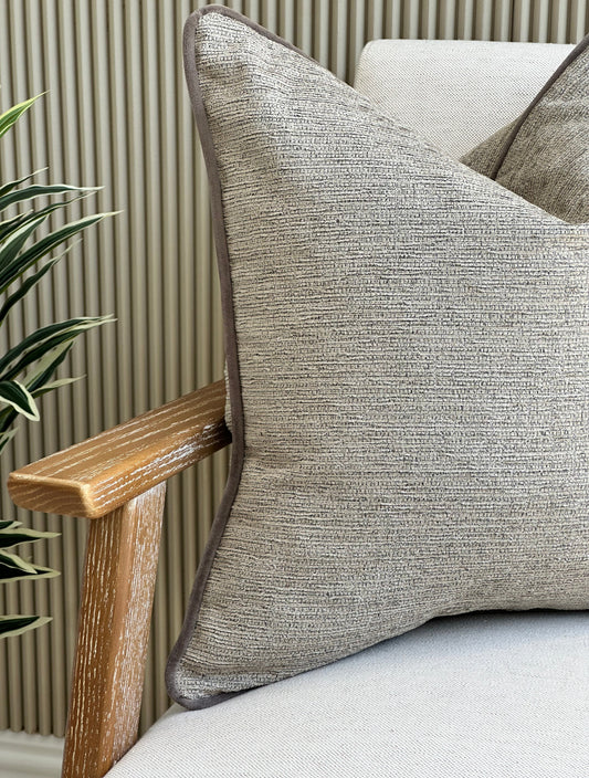Textured beige brown cushion with piping