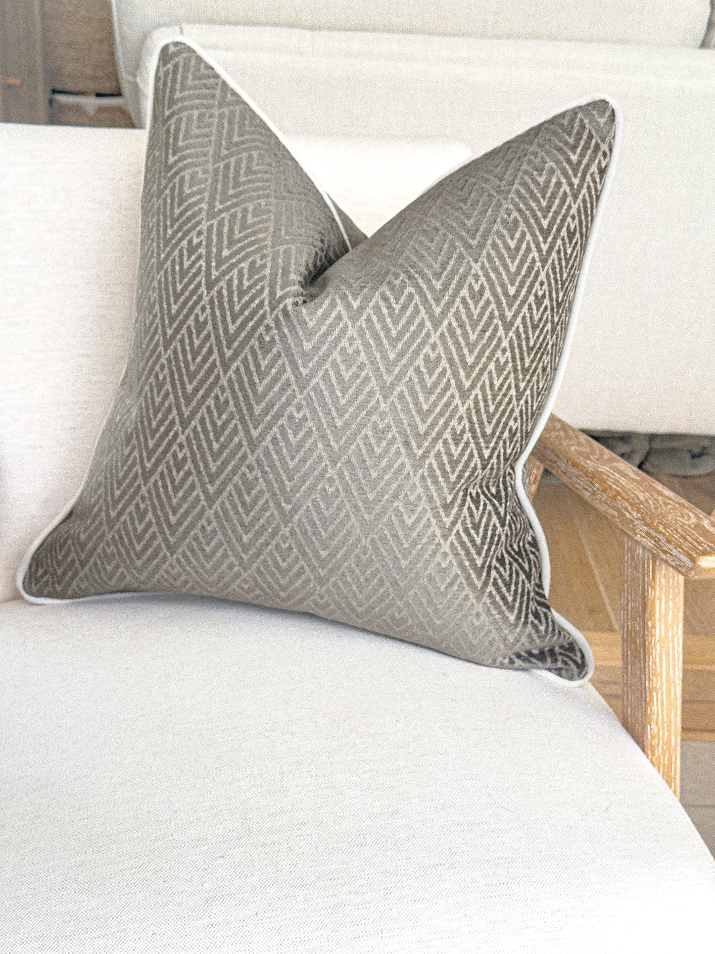 Taupe grey throw pillow with geometric design, custom made in the UK.
