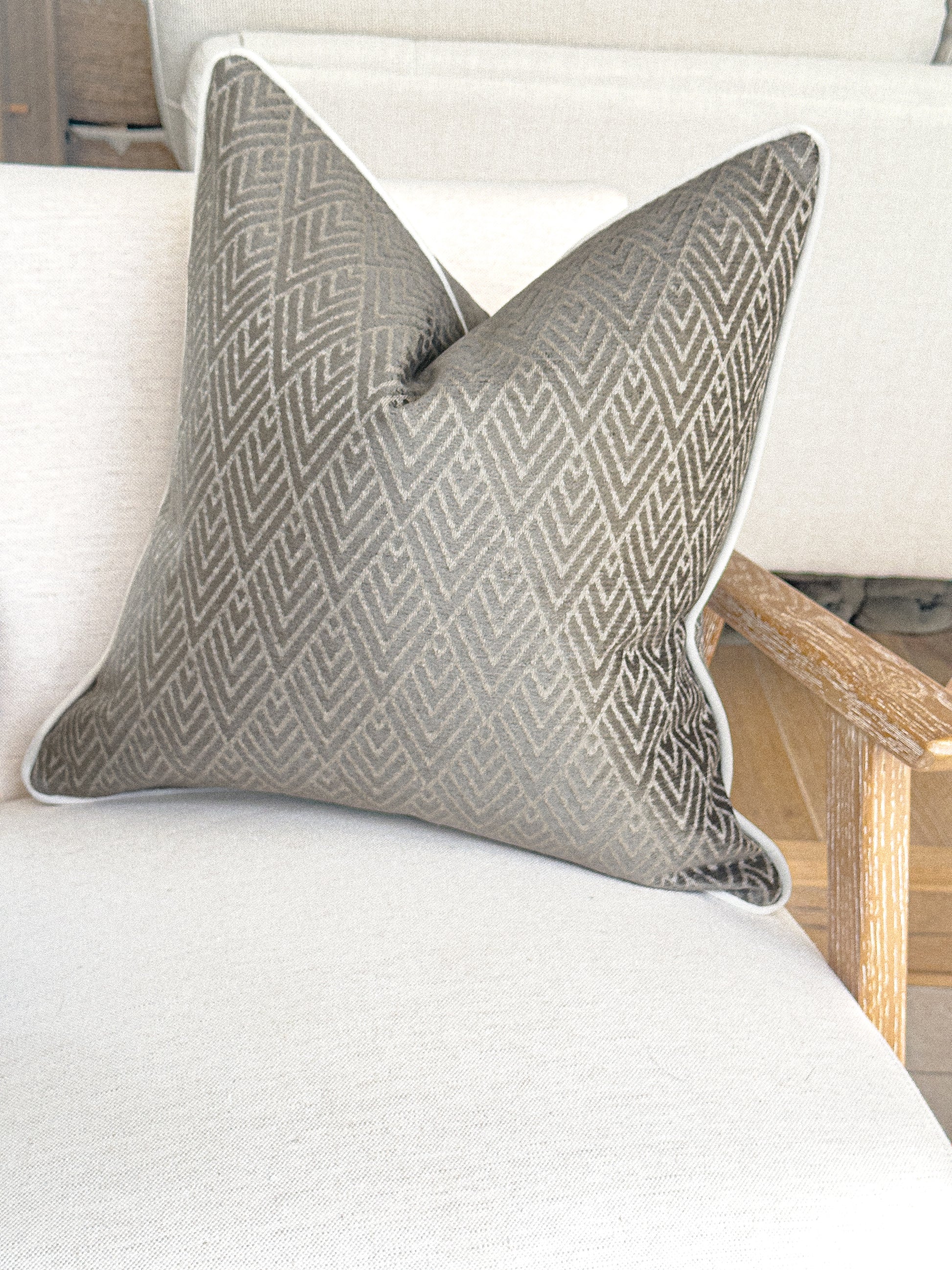 Taupe grey throw pillow with geometric design, custom made in the UK.