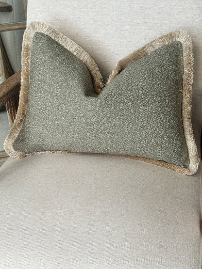 Sage green boucle fringed cushion.