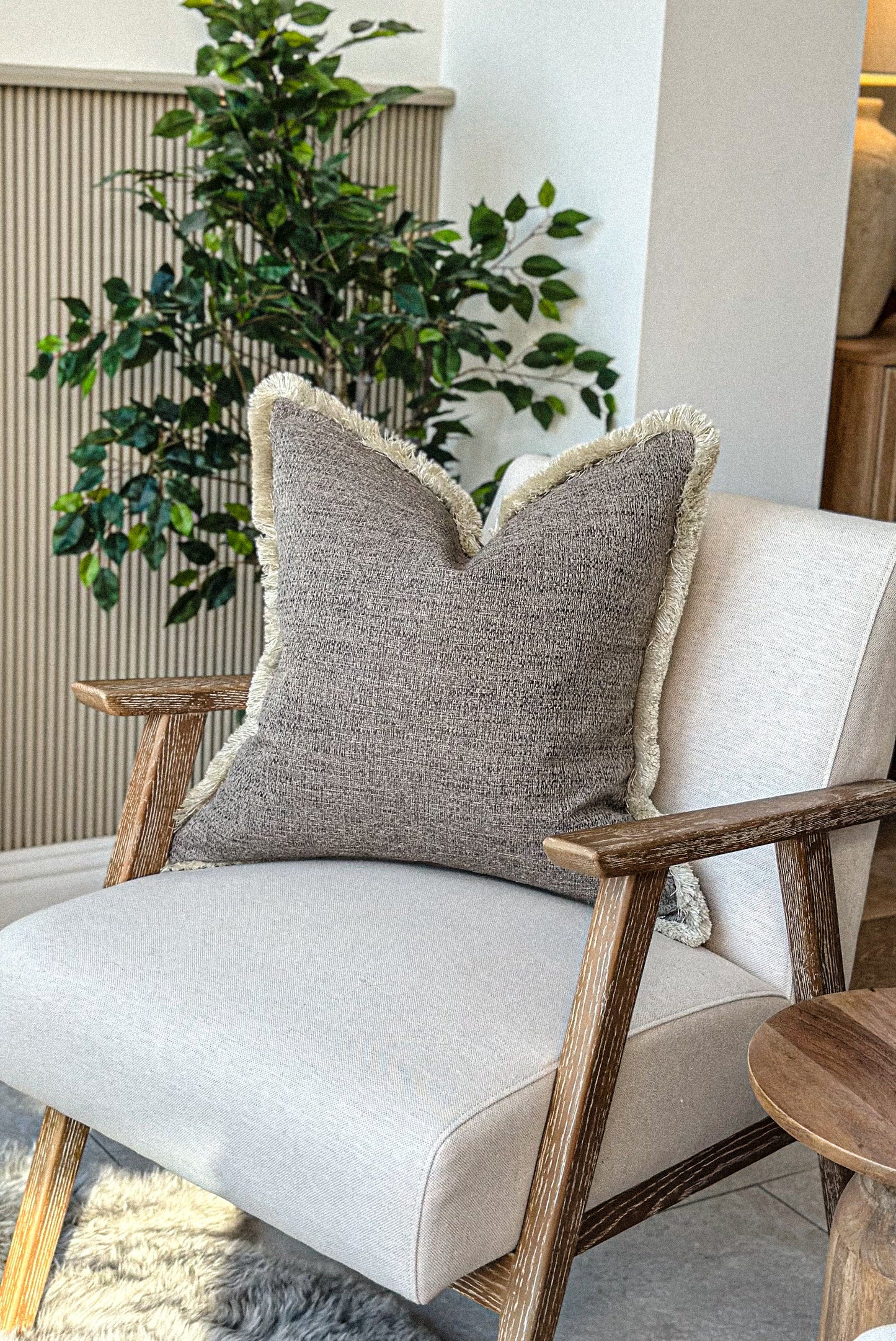 Earthy brown cushion with fringe