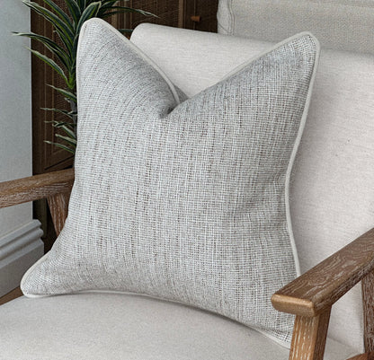 Texture neutral ivory cushion cover.