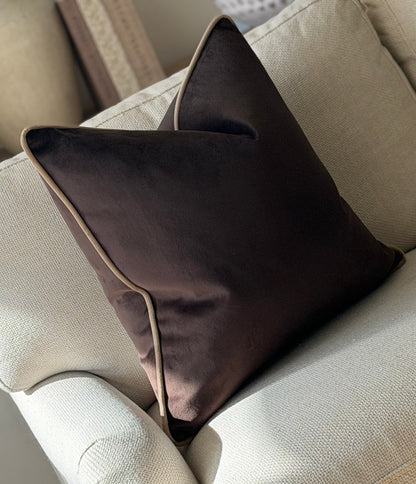 A chocolate brown velvet cushionz