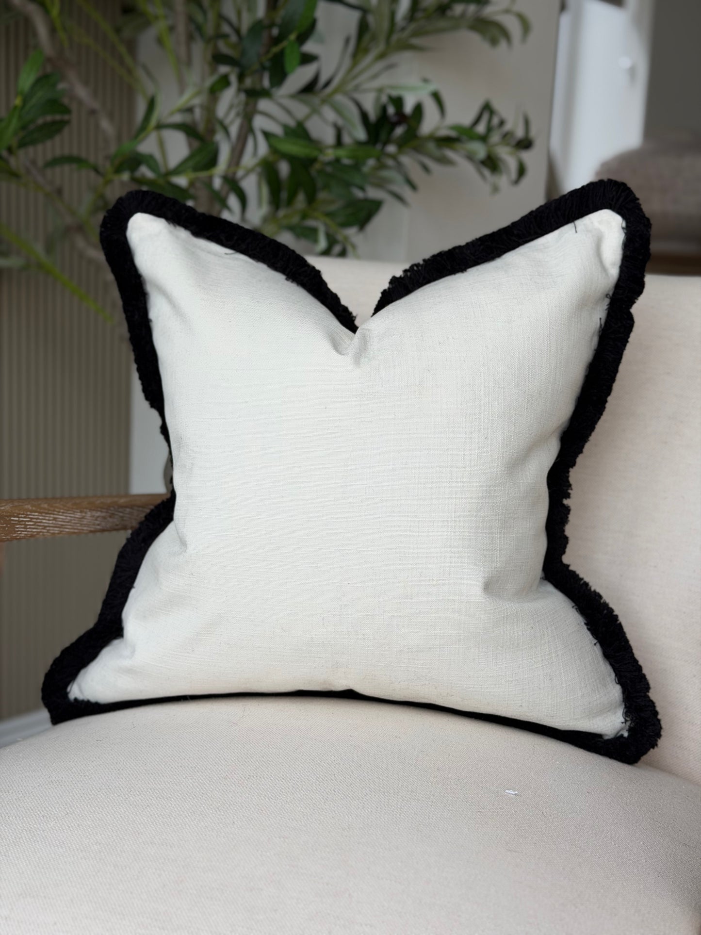 Light Ivory cotton cushion cover with black fringe