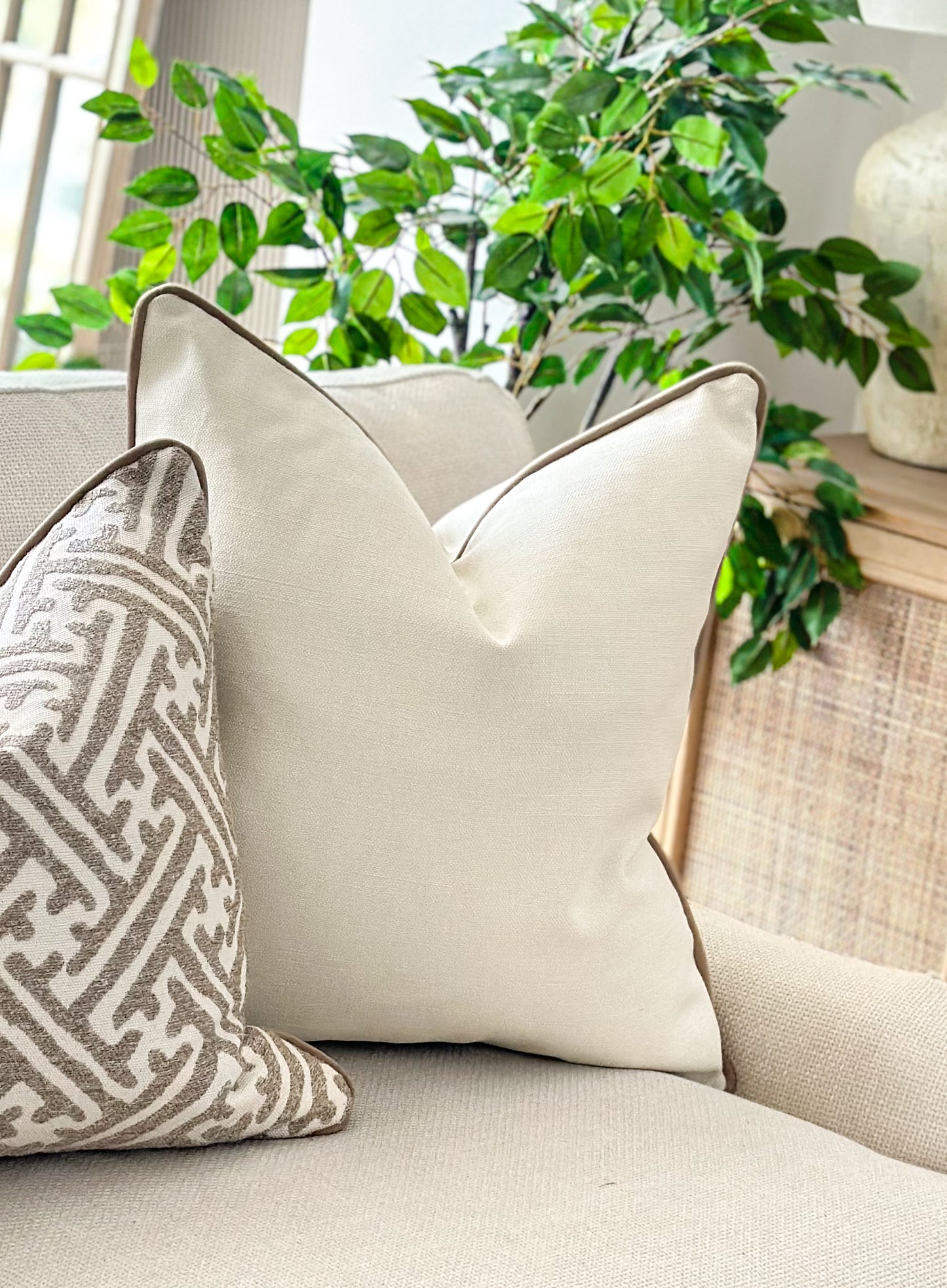 Light cream cushion with beige trim