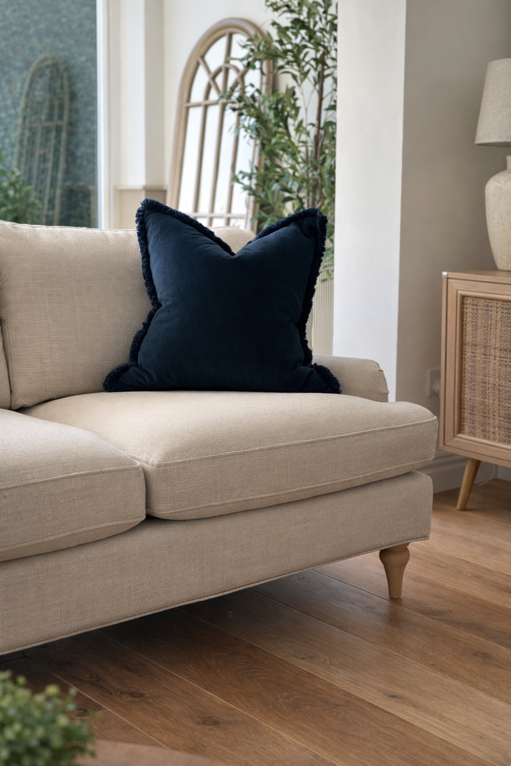 Luxury dark navy velvet cushion with a fringe trim.