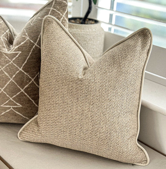Textured beige cushion with soft neutral weave — perfect for earthy, natural home déCor