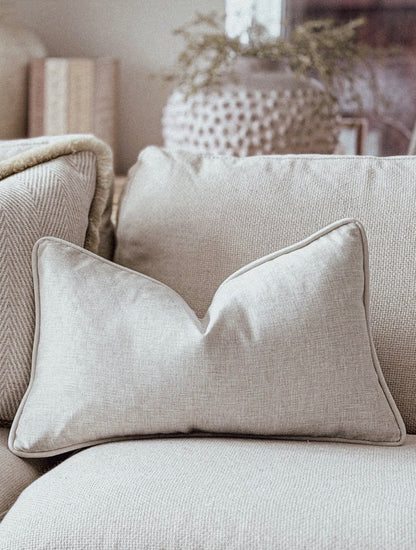 Natural rectangle cushion in a linen type material.