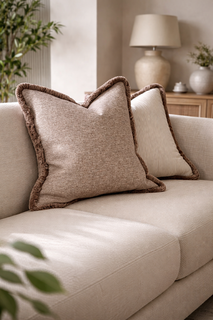 Textured taupe cushion with fringe