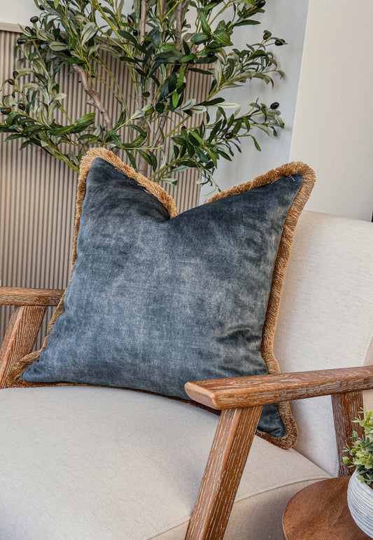 Soft aqua velvet cushion with subtle sheen — perfect for modern organic interiors.
