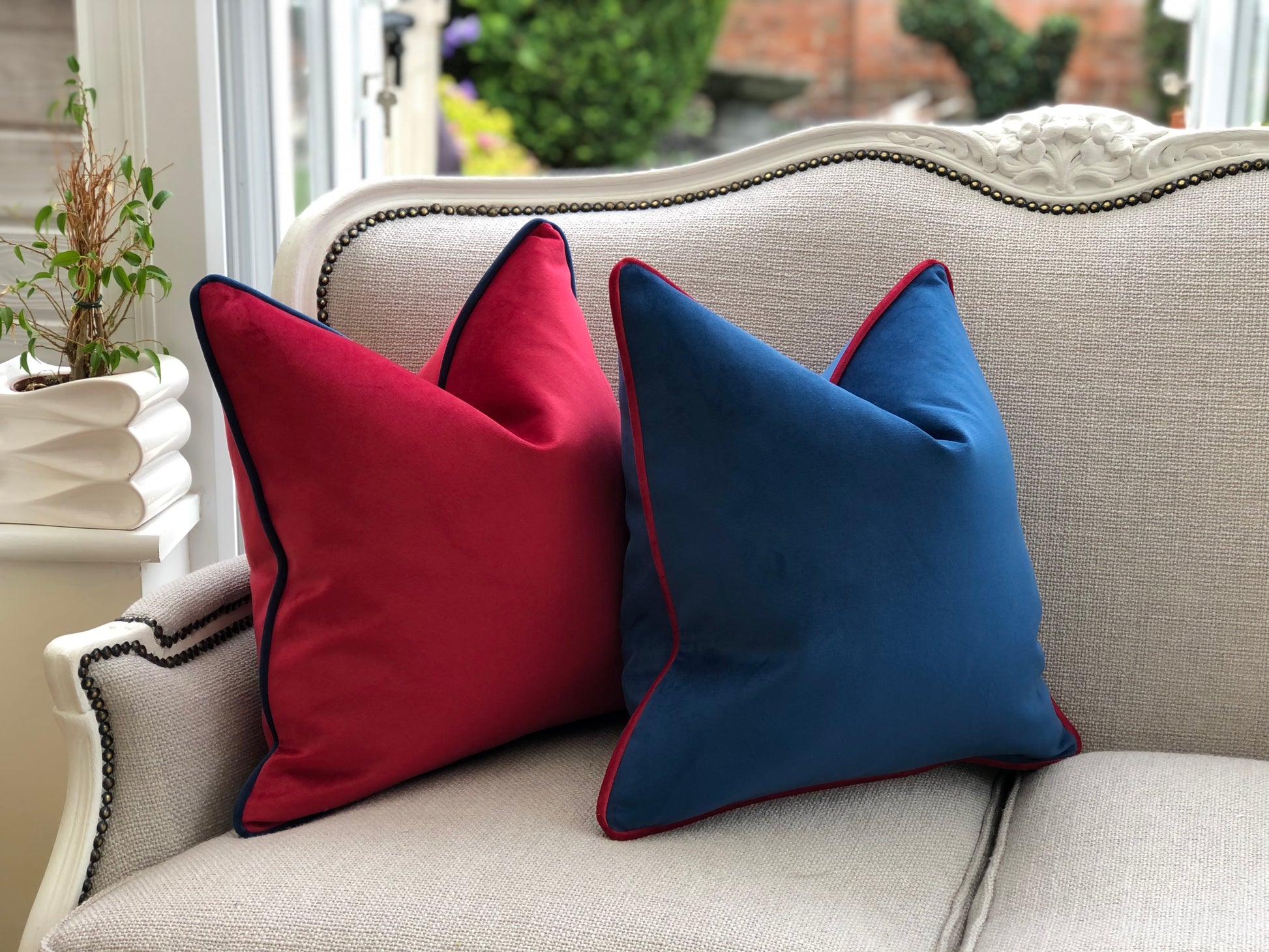 blue cushion with red piping
